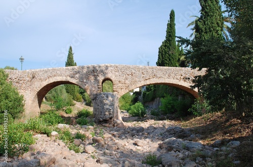The Roman bridge across the Torrente de Sant Jordi at Pollenca on the Spanish island of Majorca. photo