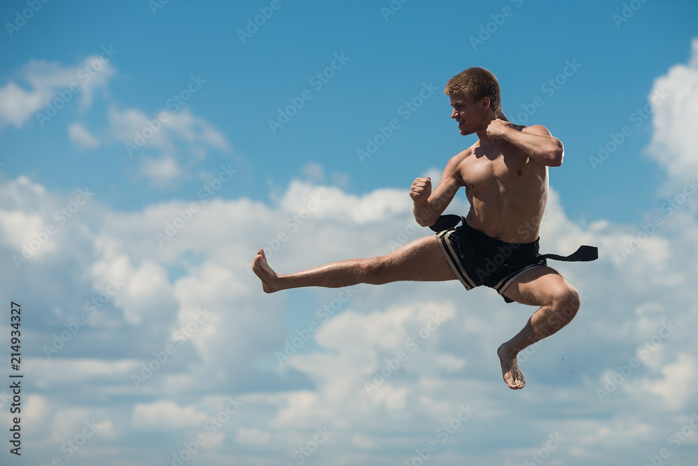 Man flying kick in sky background Man flying kick in sky background