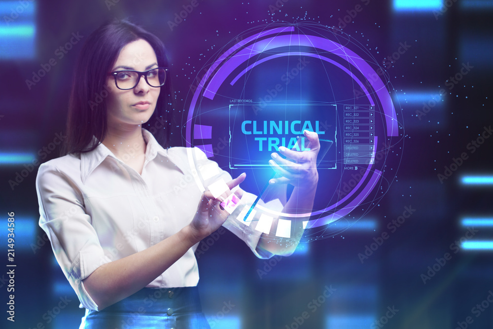 The concept of business, technology, the Internet and the network. A young entrepreneur working on a virtual screen of the future and sees the inscription: Clinical trial The concept of business, technology, the Internet and the network. A young entrepreneur working on a virtual screen of the future and sees the inscription: Clinical trial