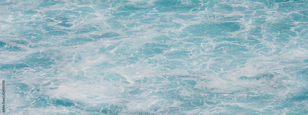 Obraz premium Indian ocean texture. Turquoise sea water with white foam. Powerful and peaceful nature concept.