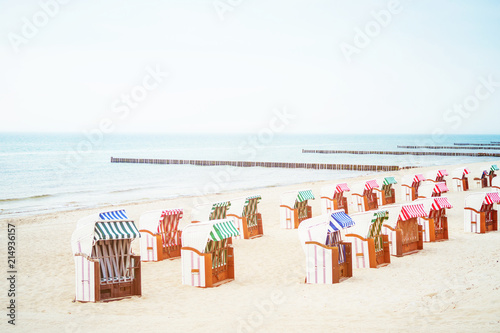 Fototapeta Naklejka Na Ścianę i Meble -  beach with beach chairs and breakwaters