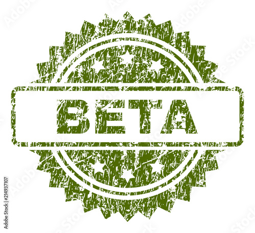BETA stamp seal watermark with rubber print style. Green vector rubber print of BETA caption with dust texture.