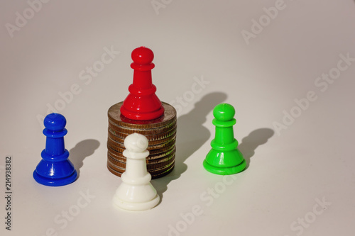 Red chess pawn on the top o...