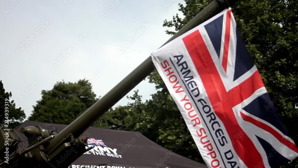 Armed forces day support flag blowing in the wind & hung from large calibre gun