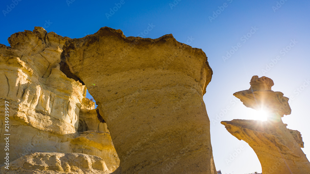 Beautiful nature view from desert on stone mountains. Outdoor scenic pictures landscape of mountains, sand and rocks. Bolnuevo Mazarron eroded sandstones in Murcia Spain