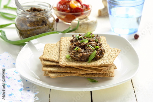 Mushroom pate and dried tomatoes with crackers, mousse