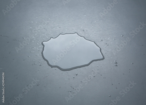 Canvas Print Liquid or water drops splash on the floor , Dark color tone, abstract background