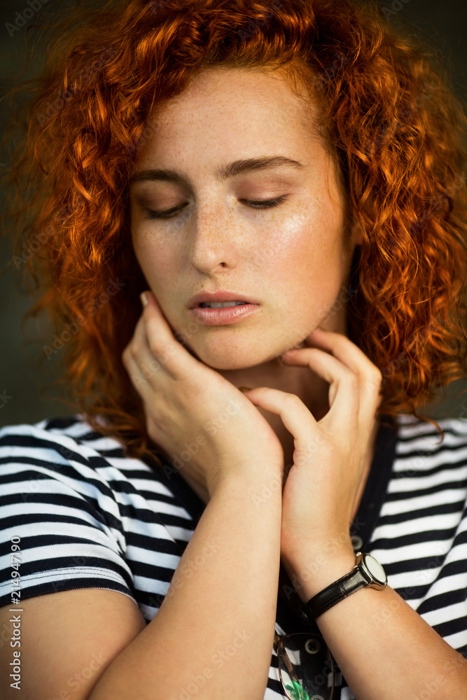 Portrait of a young beautiful ginger woman