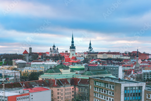 Aerial panoramic cityscape with Medieval Old Town illuminated with Saint Nicholas Church, Cathedral Church of Saint Mary and Alexander Nevsky Cathedral in Tallinn in the evening, Estonia