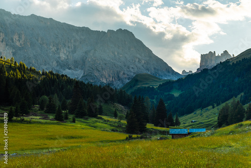 Dolomites, Italy Landscape Meadow. Famous travel destination for adventure, trekking, hiking and outdoor activity. Summer in Alps. High altitude alpine fresh green meadow. dramatic sunset in dolomites