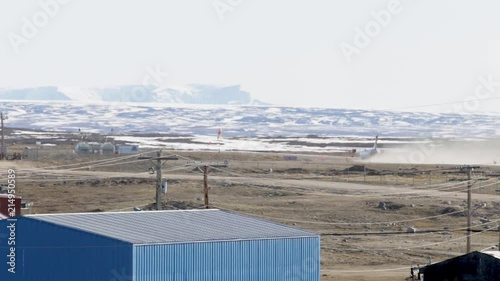 An Airplane taking off in the Distance, Pond Inlet Nunavut photo