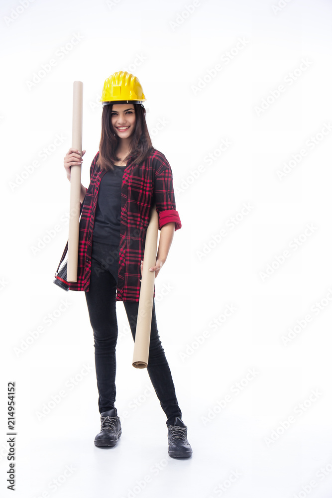 The young woman engineer with yellow safety helmet and wear safety shoes, hold blueprint in her hand,with smile and happy face The young woman engineer with yellow safety helmet and wear safety shoes, hold blueprint in her hand,with smile and happy face
