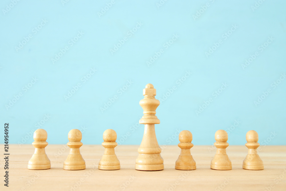 image of wooden chess ponds over table ,building a strong team, human resources and management concept. image of wooden chess ponds over table ,building a strong team, human resources and management concept.
