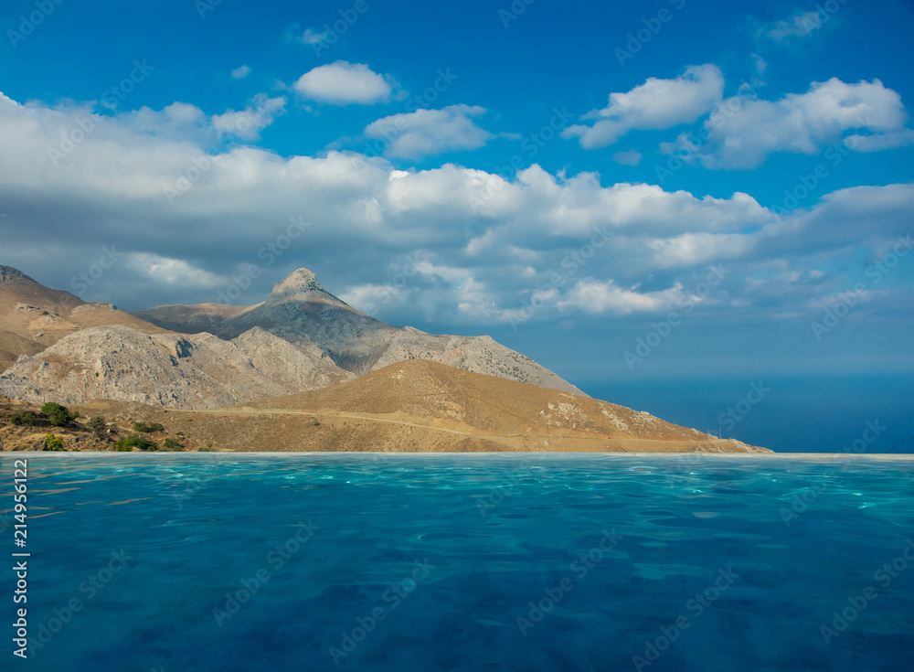 View from pool at mountaint and blue sky, Crete, Greece