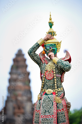 Hanuman-TossakanThai high classical dance in mask. Thai traditional dancing in a nice green, white  color shiny outfit background by historical temple in Lopburi province. © WIRAWAN