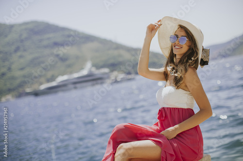 Pretty young woman by the sea