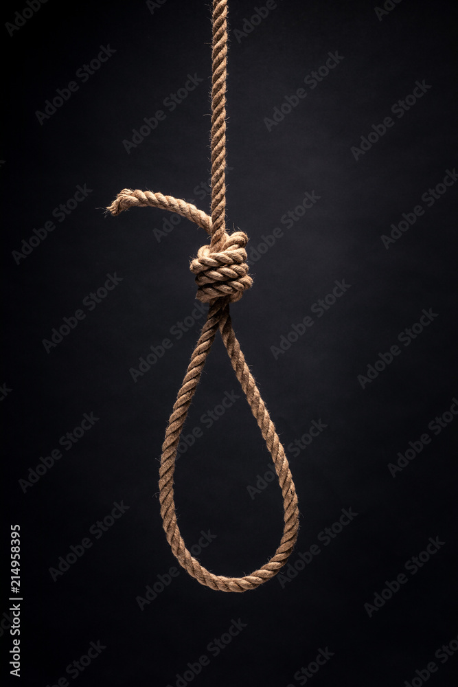 Noose. The concept of murder or suicide. On dark background