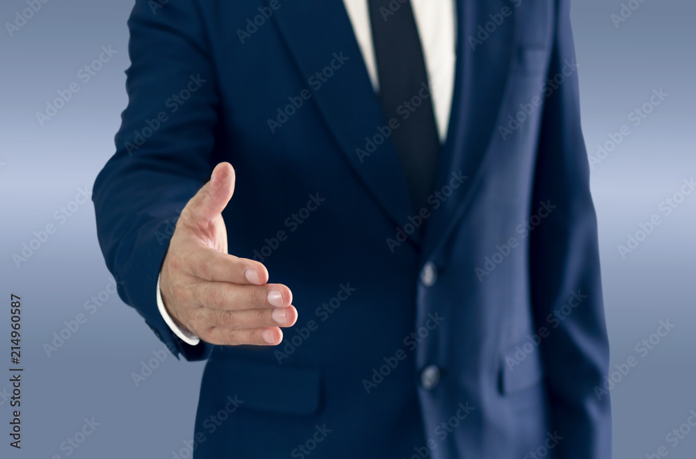 A businessman is standing and shaking hands. A businessman is standing and shaking hands.
