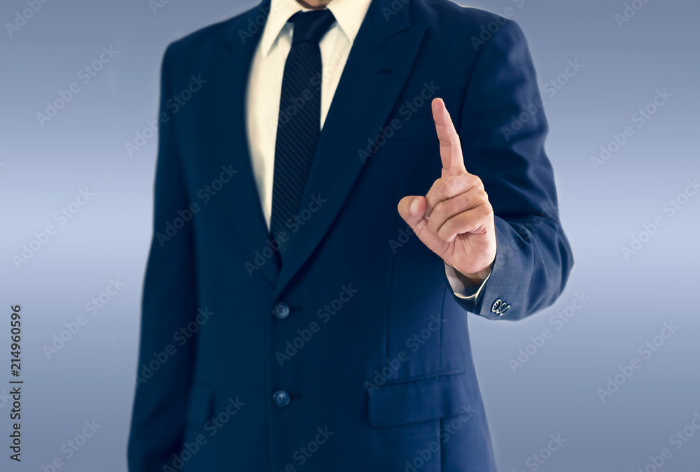A businessman is standing and pointing hand. A businessman is standing and pointing hand.