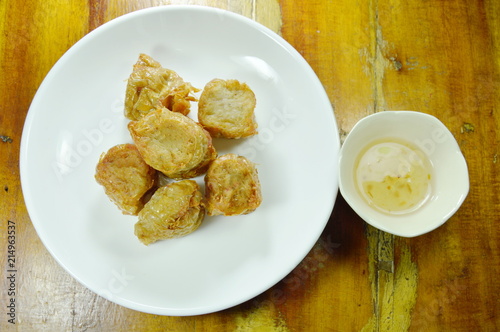 crispy deep fried crab meat roll in flour dipping with plum sauce