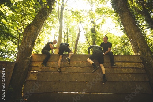 Fit mens training over obstacle course