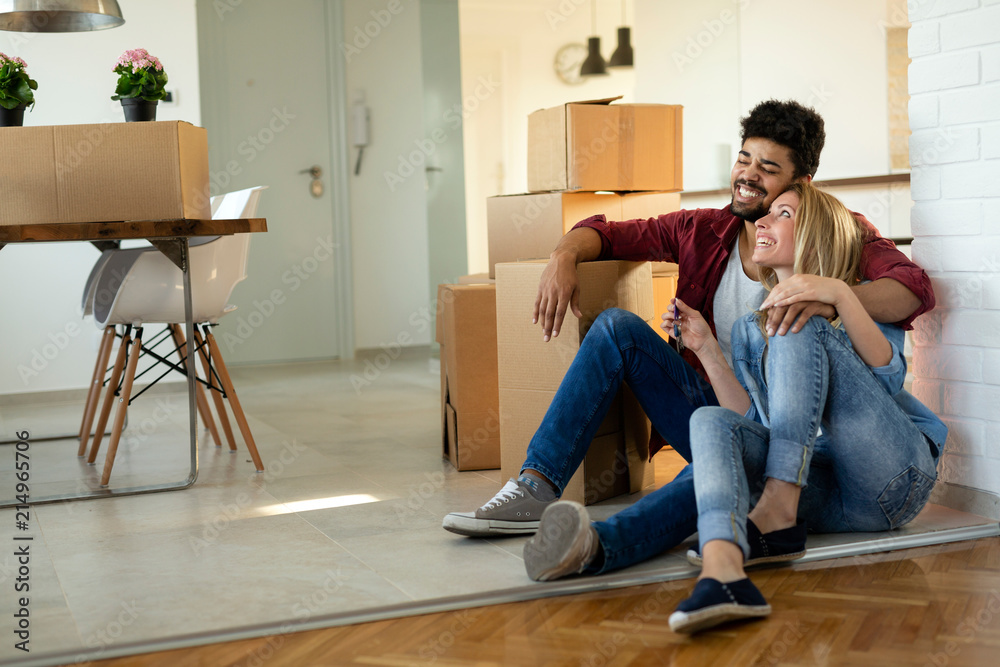 happy couple having fun while moving in happy couple having fun while moving in