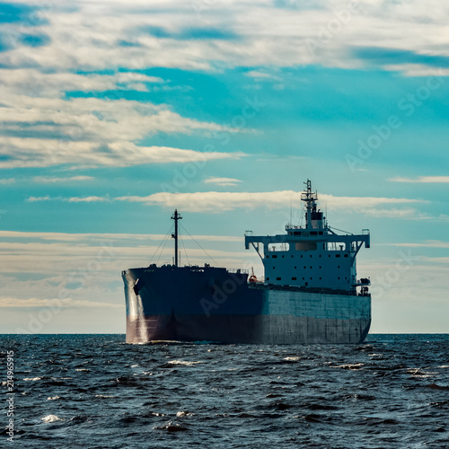 Blue cargo ship underway © InfinitumProdux