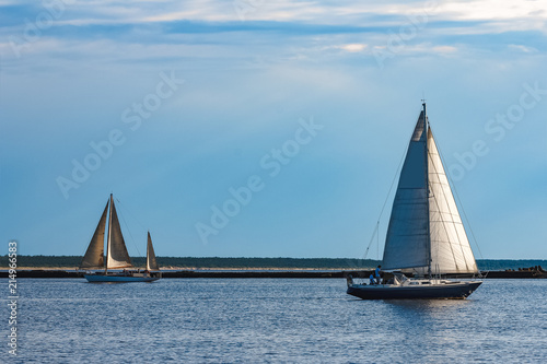 Blue sailboat at river
