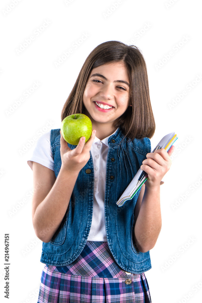 schoolgirl with notebook and apple on white background