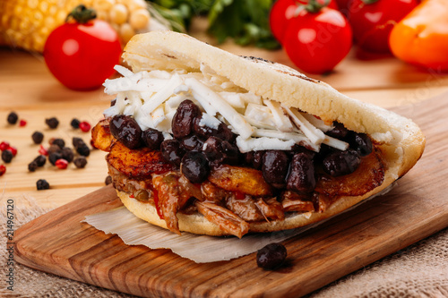 The typical Venezuelan Arepa called Pabellon, which has seasoned minced meat, fried plantain, black beans and white cheese