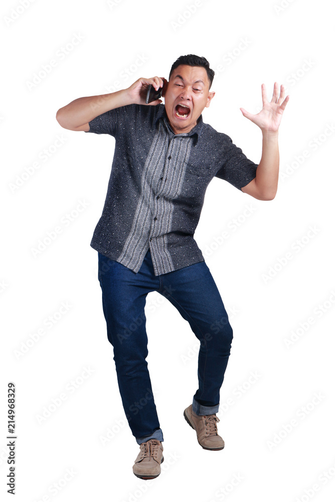 Young Man Yelling at His Phone, Angry Expression Young Man Yelling at His Phone, Angry Expression