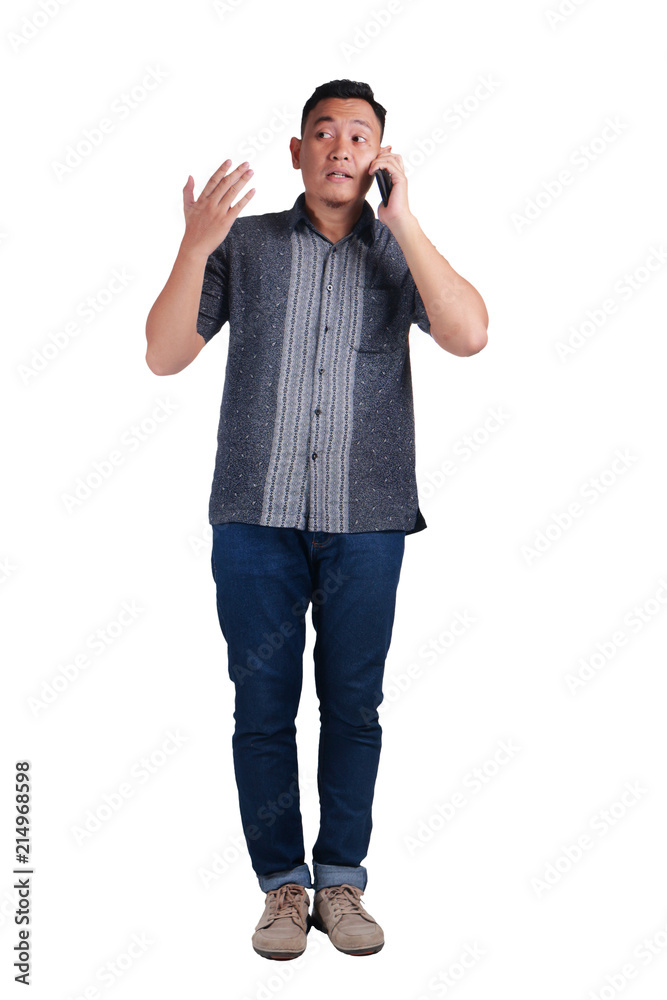 Fototapeta premium Young Man Talking on Phone, Explaining Something Gesture
