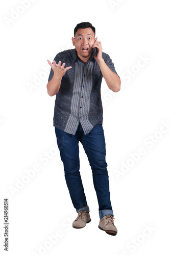 Young Man Talking on Phone, Shocked Worried Expression © airdone