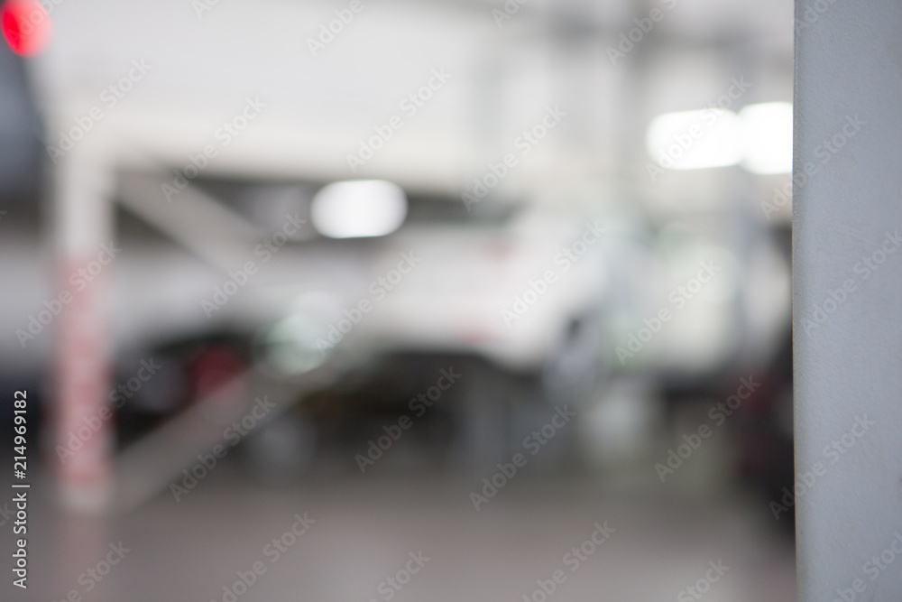 Car in garage, auto repair service shop with special repairing equipment Car in garage, auto repair service shop with special repairing equipment