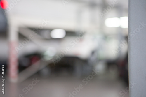 Car in garage, auto repair service shop with special repairing equipment © biggur