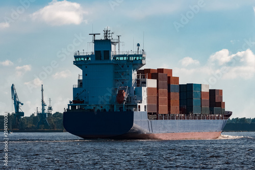 Blue container ship underway