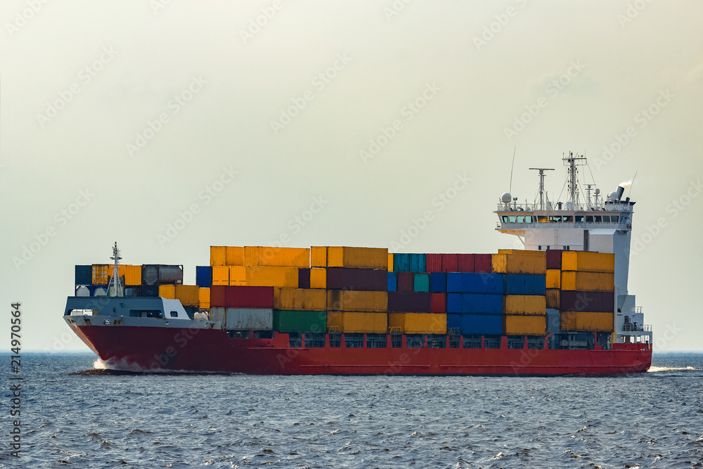 Fototapeta premium Red container ship underway