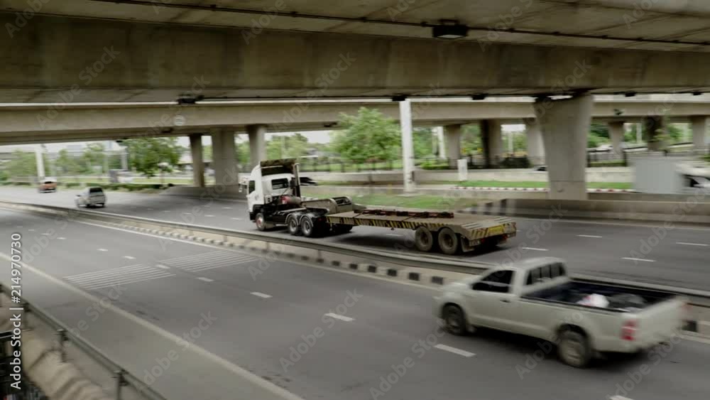 Bangkok/Thailand-July 23 2018 : flat bed trailer on highway Bangkok/Thailand-July 23 2018 : flat bed trailer on highway