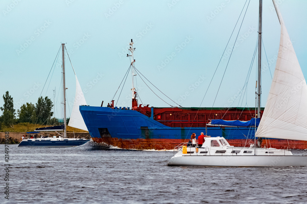Fototapeta premium Blue cargo ship underway