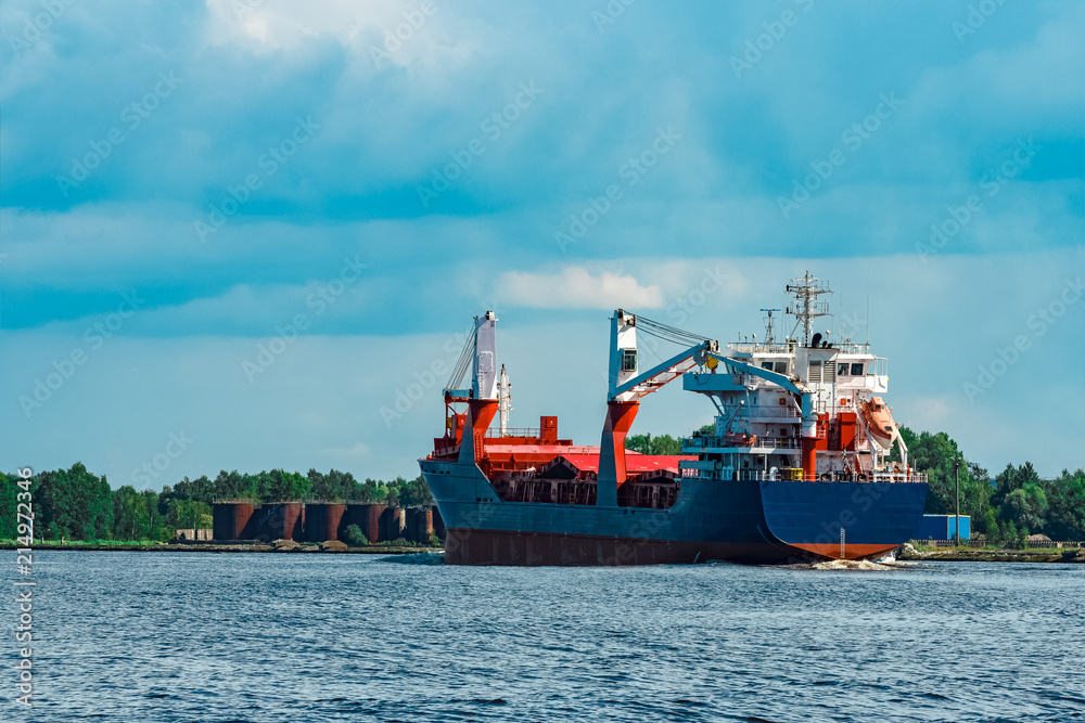 Blue cargo ship underway Blue cargo ship underway