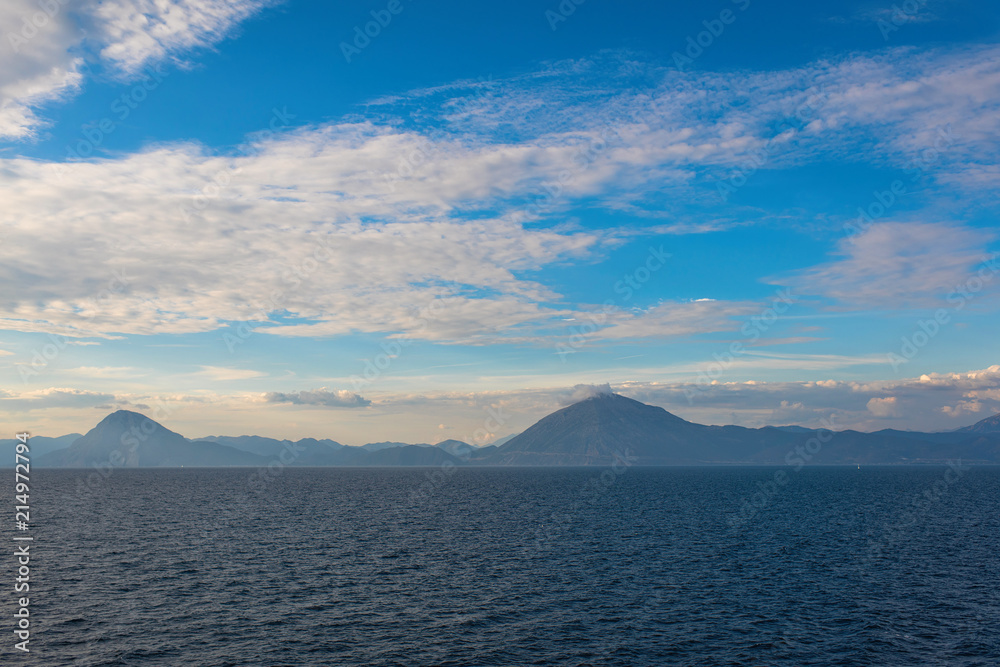 View of the Greek island of Makri from the ferry at sunset. Greek islands in the Ionian Sea