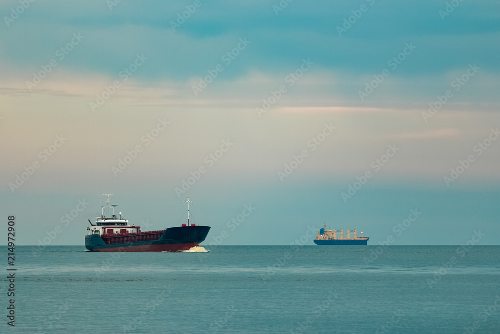 Obraz premium Blue cargo ship underway