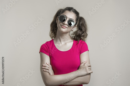 Portrait of a mixed-race teenager girl in sunglasses. 