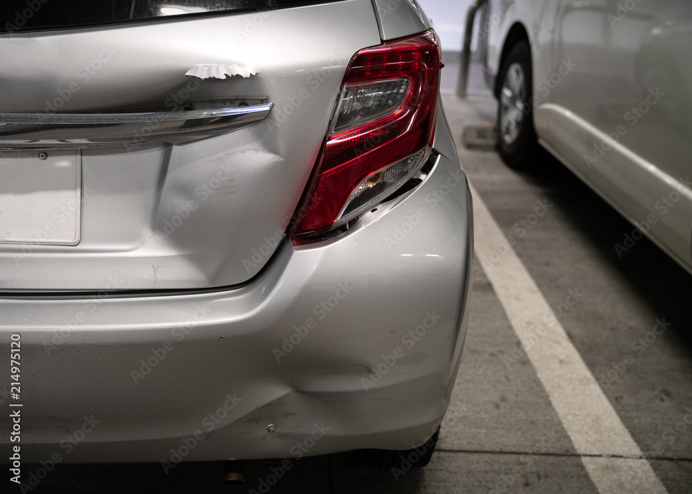 Backside of new silver car get damaged by accident