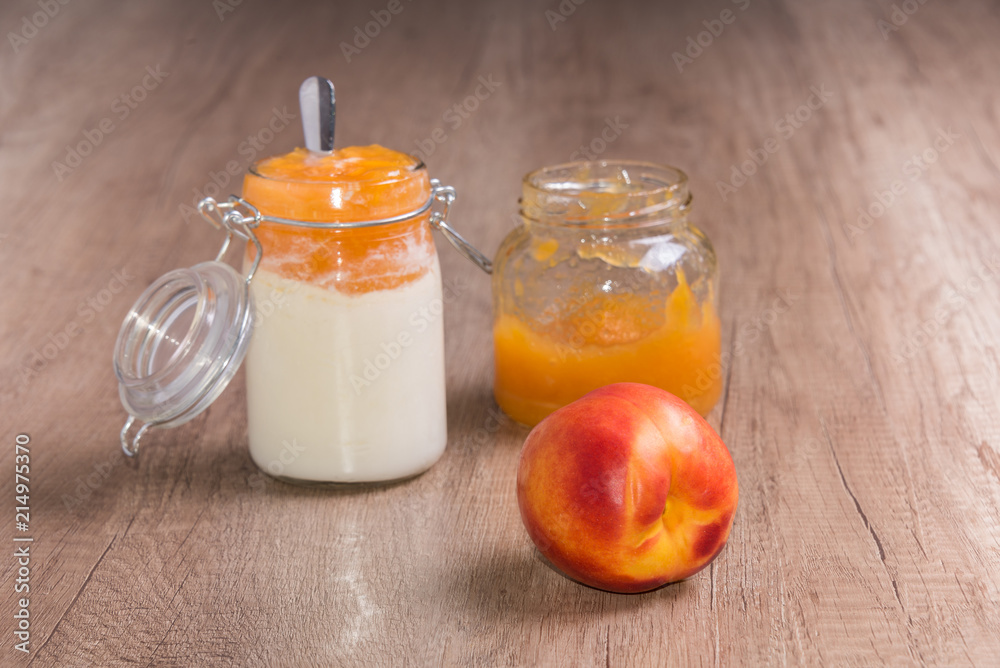 Zero waste health meal homemade yogurt and peach on wooden table Zero waste health meal homemade yogurt and peach on wooden table