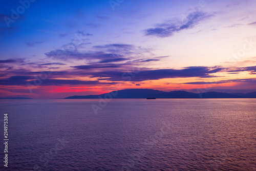 View of the Greek islands of Ithaca and Kefalonia from the ferry ship at sunset. Greek islands in the Ionian Sea