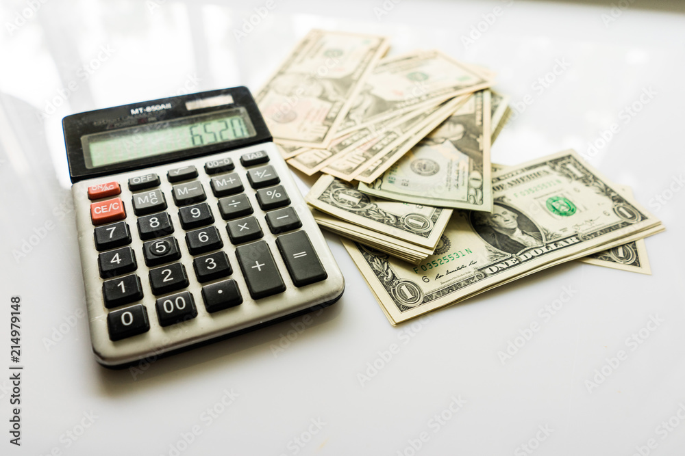 Close-up Money and Calculator, American Dollar Banknotes Close-up Money and Calculator, American Dollar Banknotes