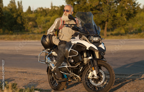 Portrait of a senior man outdoors. Old biker portrait.