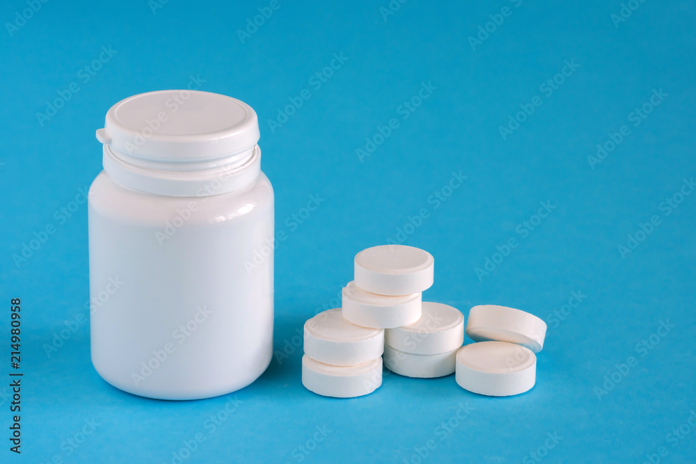 Medicine. Pills near the box on a blue background, copy space, assorted pharmaceutical Medicine. Pills near the box on a blue background, copy space, assorted pharmaceutical