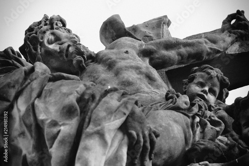Fotografia, Obraz Bottom view of ancient statue of the crucifixion of Jesus Christ with angels (Fa